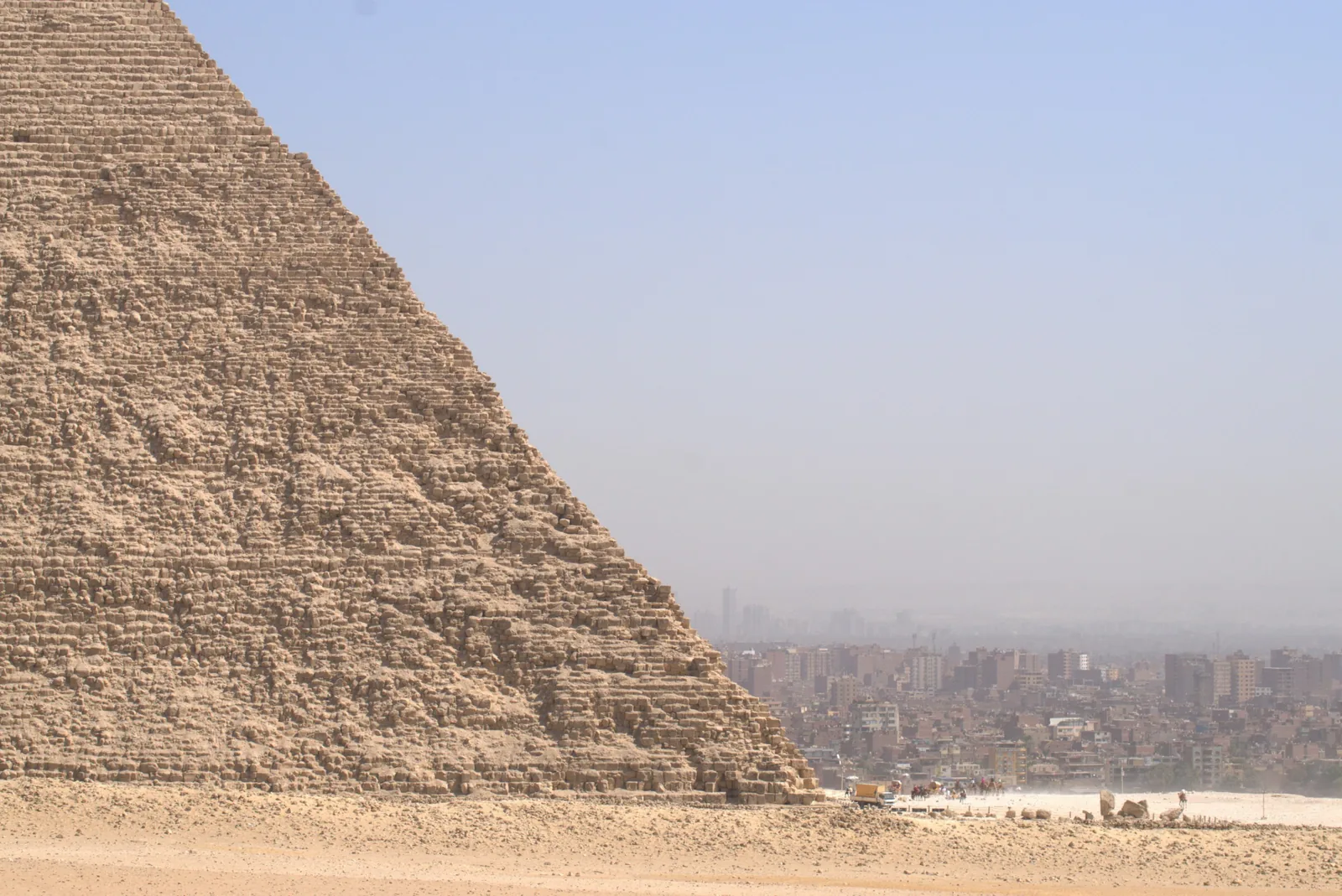 The Great Pyramid With Cairo In The Distance